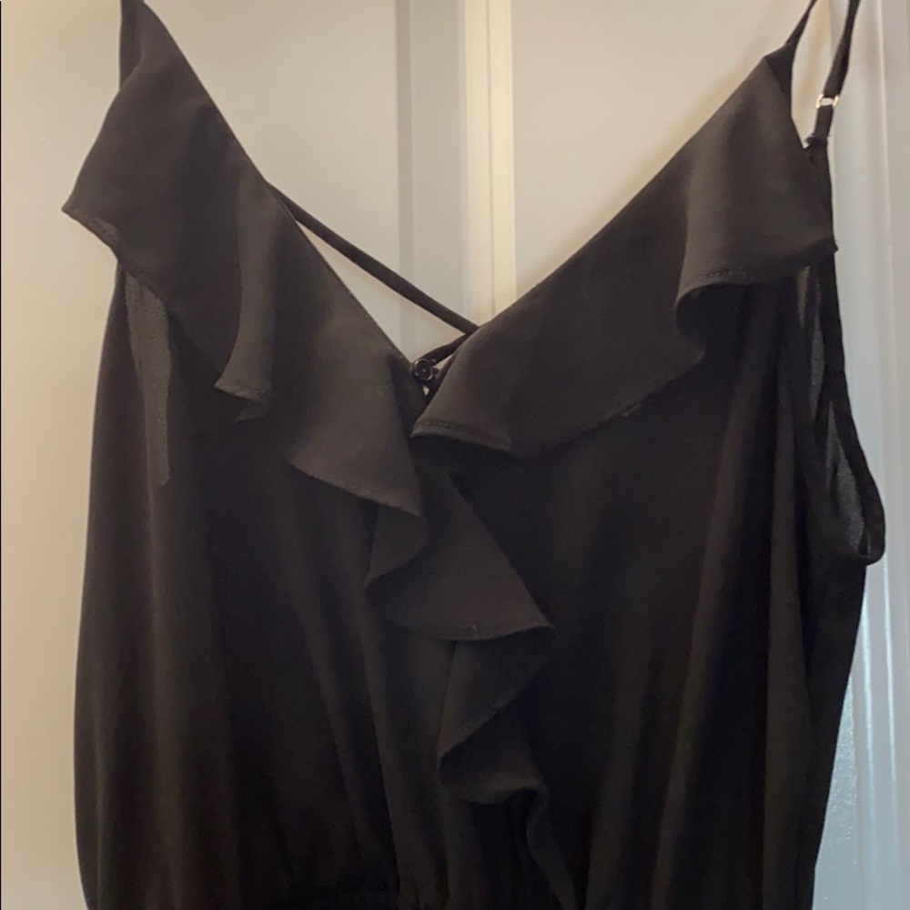 Black dress with ruffles and cross back